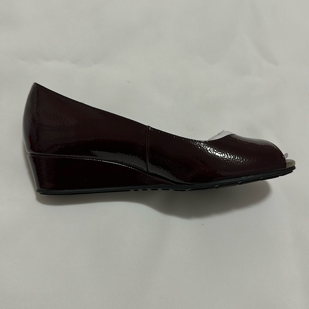 Bandolino wine colored peep toe wedges.